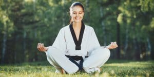 Martial Arts Lessons for Adults in Middle River MD - Happy Woman Meditated Sitting Background